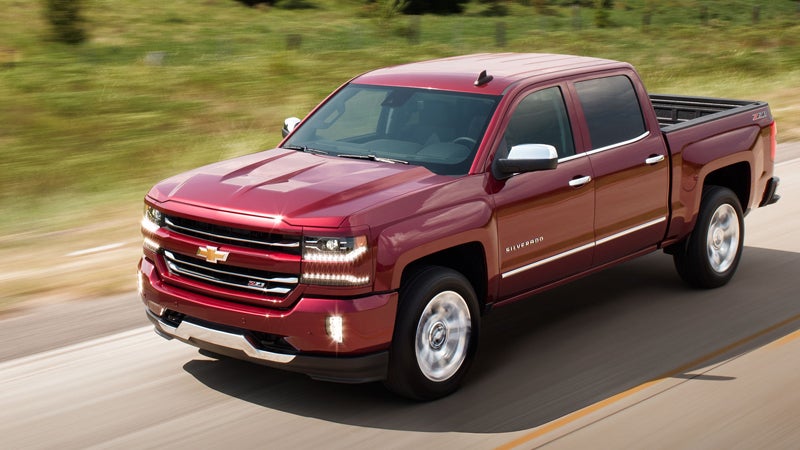 Red 2017 Chevy Silverado 1500 on road